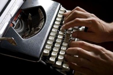 person-typing-on-typewriter